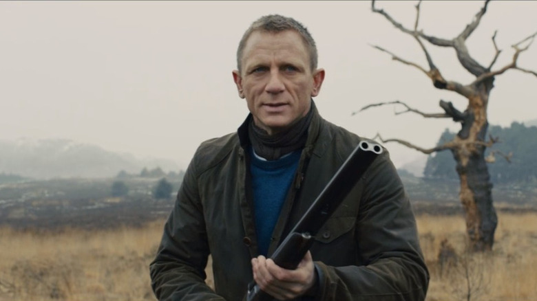 James Bond holding a shotgun