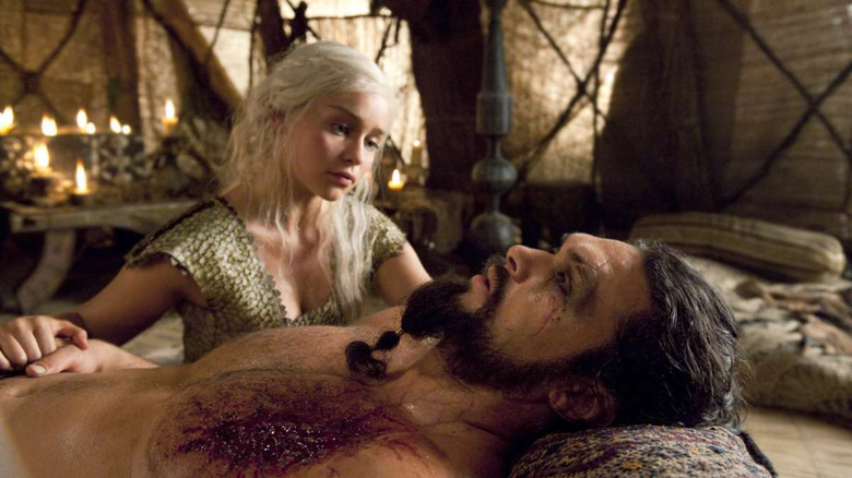 Daenerys looking down at sick Drogo