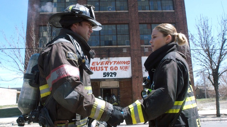 Kelly Severide and Leslie Shay outside burning building