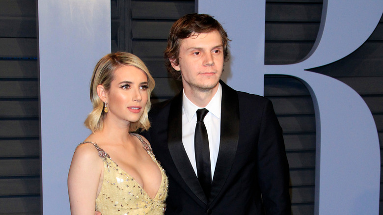 Emma Roberts and Evan Peters posing