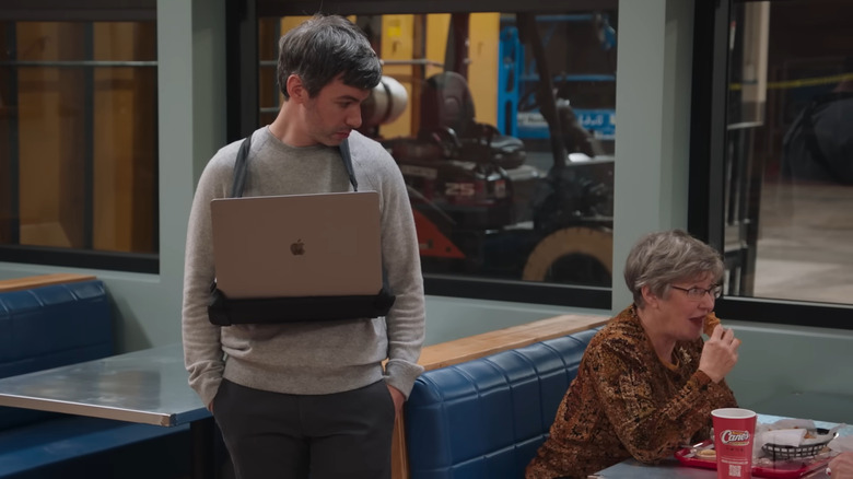 Nathan Fielder watching a woman eat on The Rehearsal