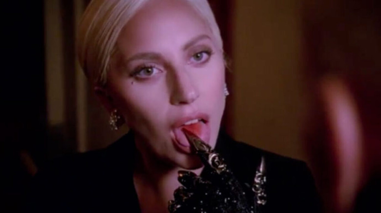 The Countess licking her finger