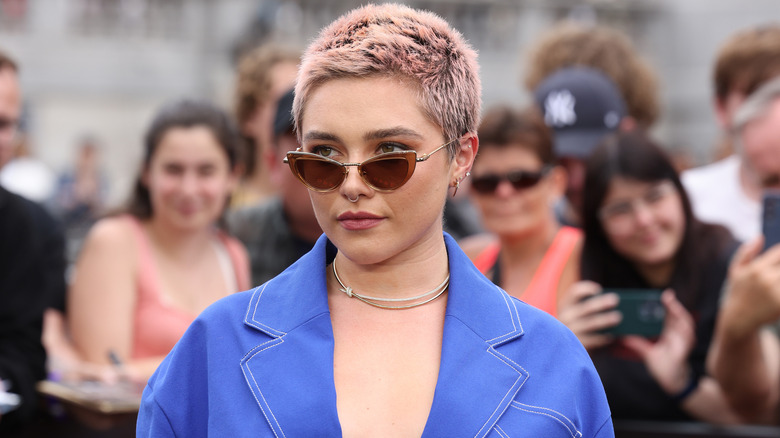 Florence Pugh wearing orange sunglasses