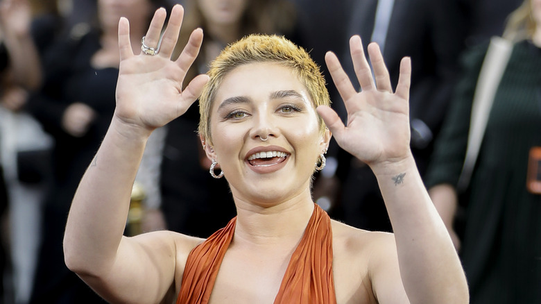 Florence Pugh waving her hands