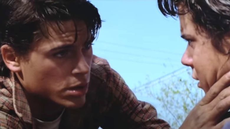 Sodapop checking Ponyboy's face in The Outsiders