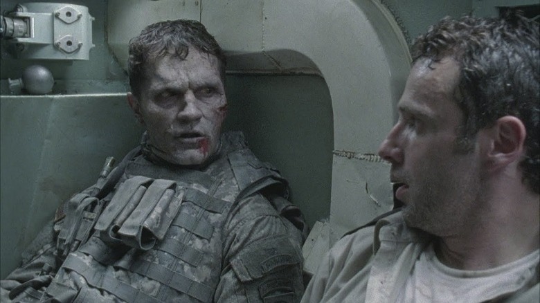 Rick Grimes in a tank with a walker