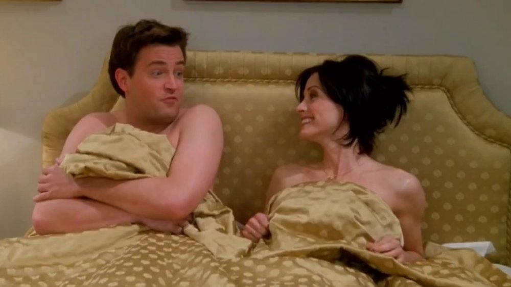 Matthew Perry as Chandler and Courtney Cox as Monica in Friends