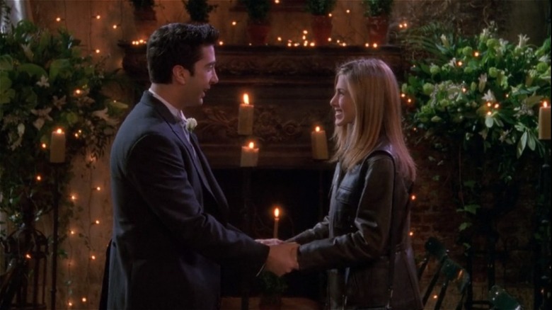 Ross and Rachel hold hands