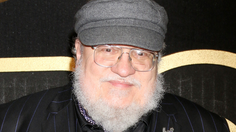 George R.R. Martin smiles at an event