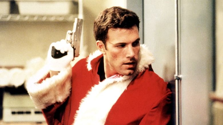 Ben Affleck dressed as Santa holding gun