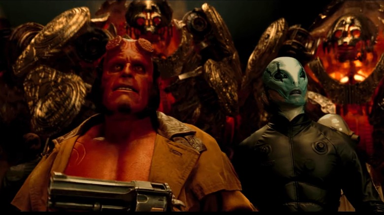 The Golden Army surrounds Hellboy and Abe 