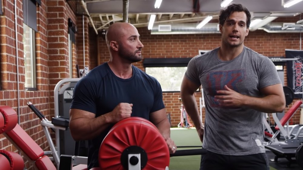 Dave Rienzi and Henry Cavill at the glute hams machine