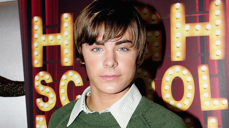 Zac Efron posing at HSM event