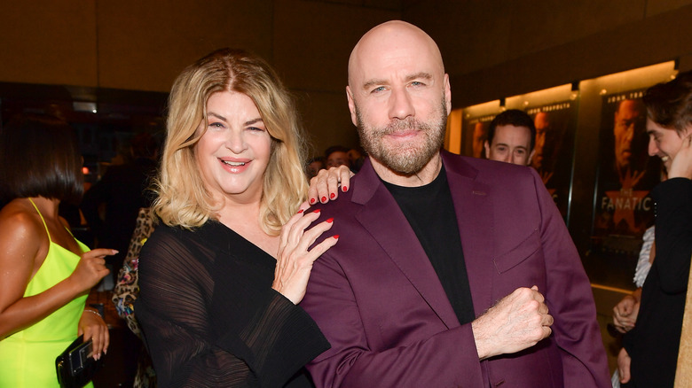 Kirstie Alley hugging John Travolta 