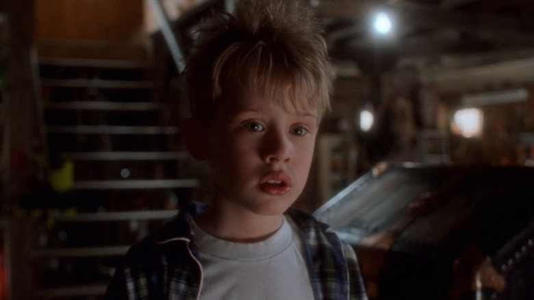 Home Alone's Kevin McCallister looking nervously