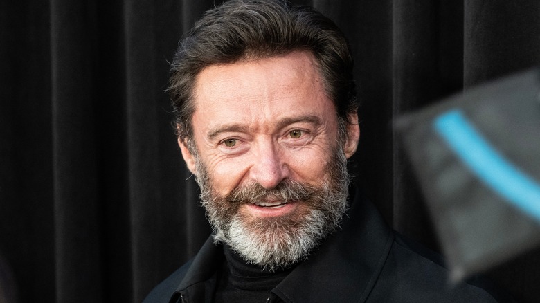 Bearded Hugh Jackman smiling