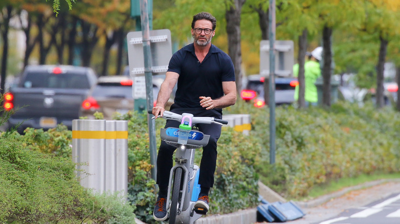 Hugh Jackman riding a bike