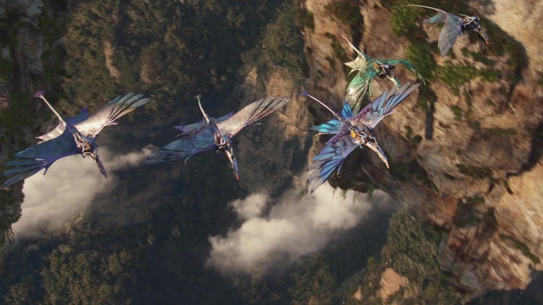 Members of the Na'vi tribe riding mountain banshees