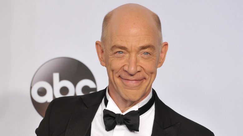 J.K. Simmons smiling in tuxedo