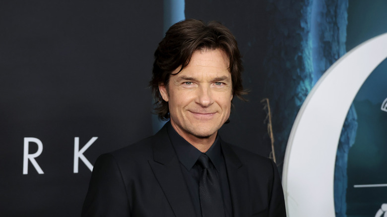 Jason Bateman smiling for press