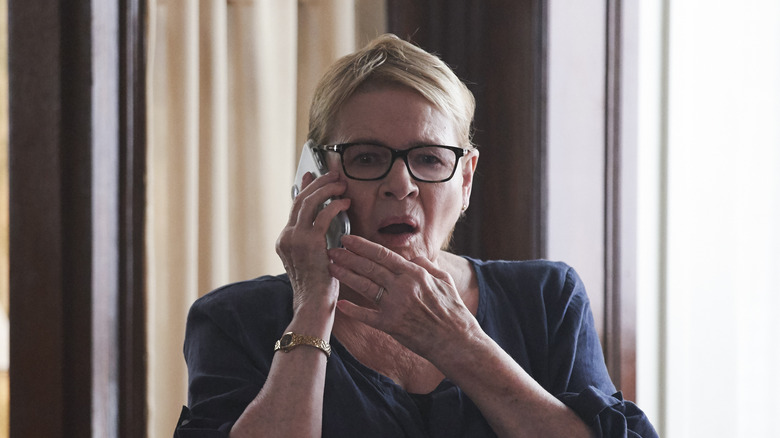 Dianne Wiest as Miriam looking shocked on the phone