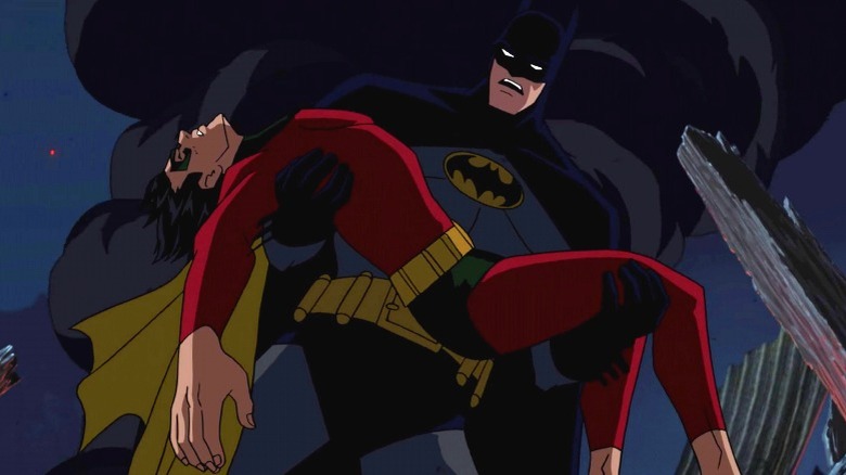 Batman holding Robin's body