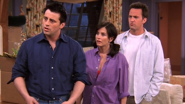 Joey Tribbiani, Monica Geller, Chandler Bing looking serious to the left