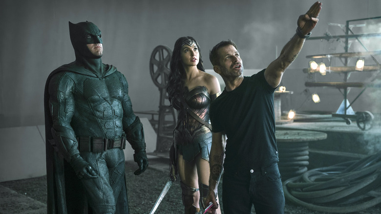 Zack Snyder pointing up with Gal Gadot