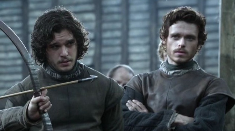 Jon Snow and Robb Stark watching Bran Stark do archery