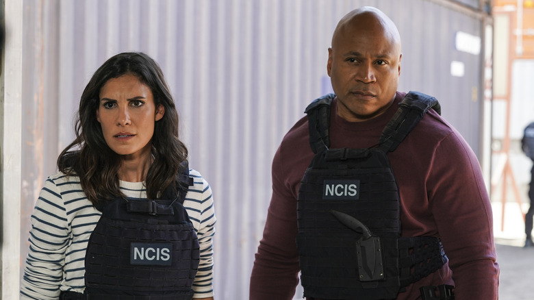 Daniela Ruah and LL Cool J walking on the set of NCIS Los Angeles