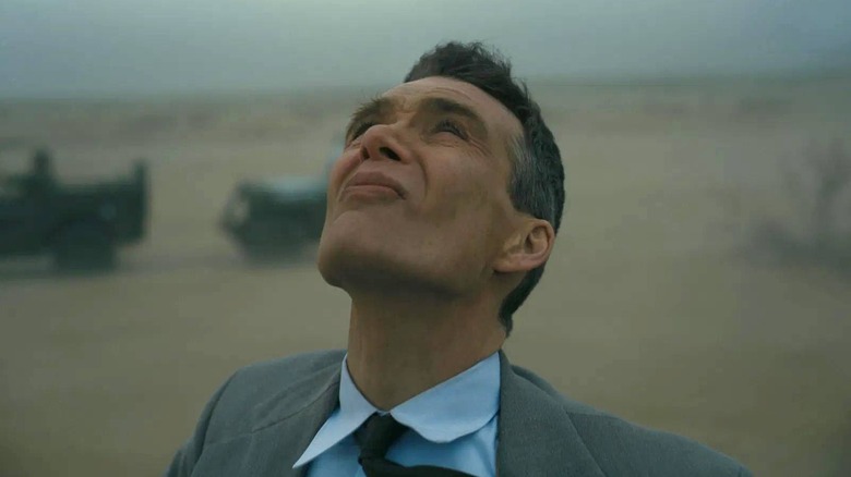 Oppeneheimer staring up at a dust storm in Oppenheimer (2023)