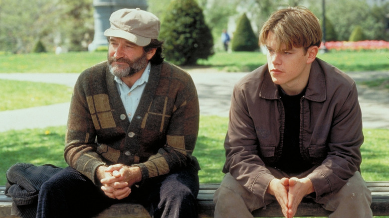 Sean and Will sitting on a park bench together in Good Will Hunting (1997)