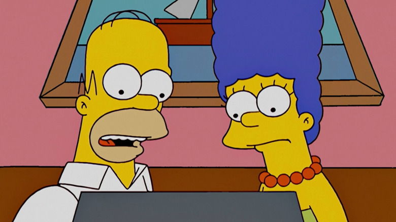 Homer and Marge watching TV screen