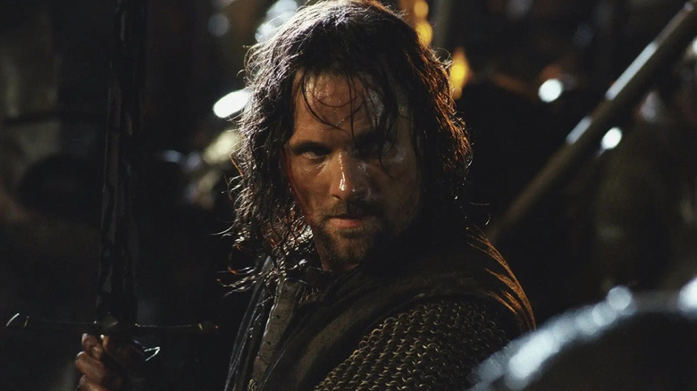 Aragorn holding sword in battle