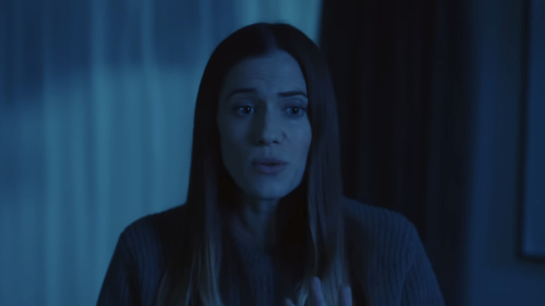 Gemma looks concerned in the dark