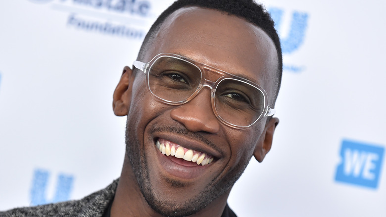 Mahershala Ali with glasses on red carpet