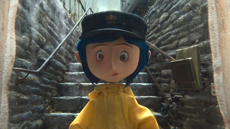 Coraline stands on stairs