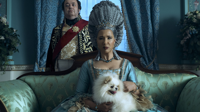 Old Queen Charlotte holding dog