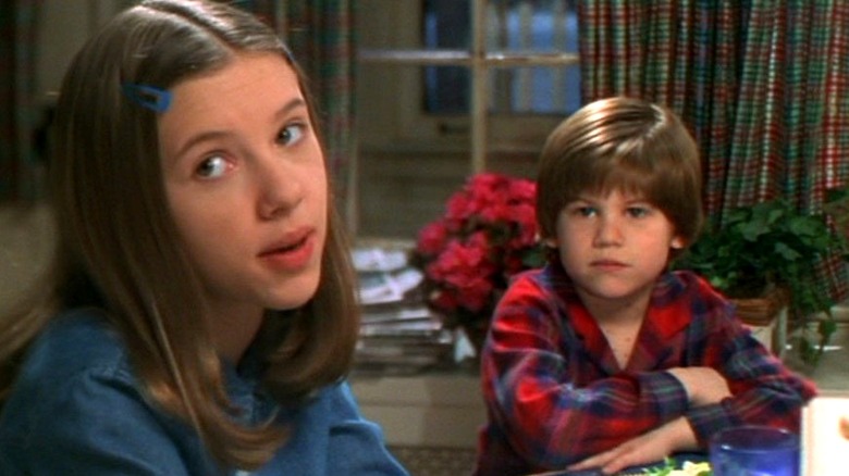 Alex and his sister Molly sitting at the dining room table