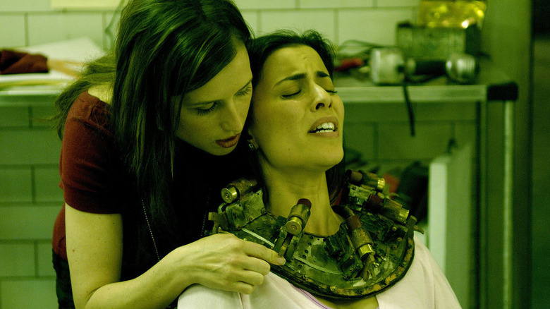 Amanda inspecting a trap in progress in 2006's "Saw III"