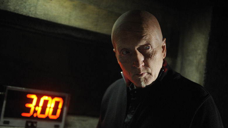 John Kramer stands in front of a timer in 2008's "Saw V"