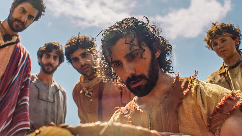 Andrew, Thomas, Judas, and Matthew watch as the bread and loaves are multiplied