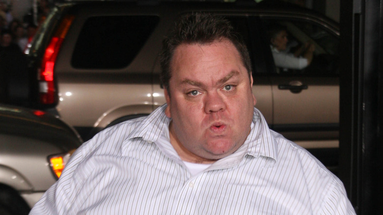 Preston Lacy stands on a street corner