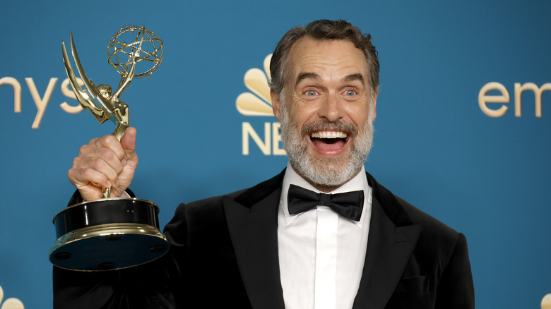 The White Lotus star Murray Bartlett poses with his award at the 74th Primetime Emmy Awards