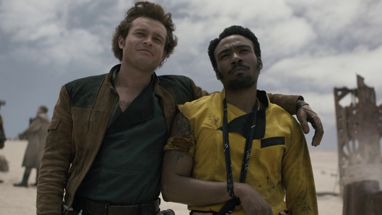 Han Solo with his arm around Lando Calrissian