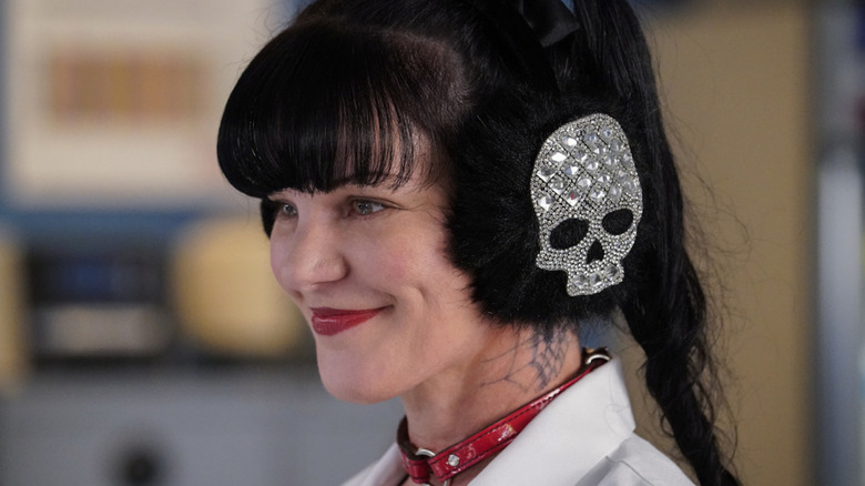 Pauley Perrette wearing skull earmuffs