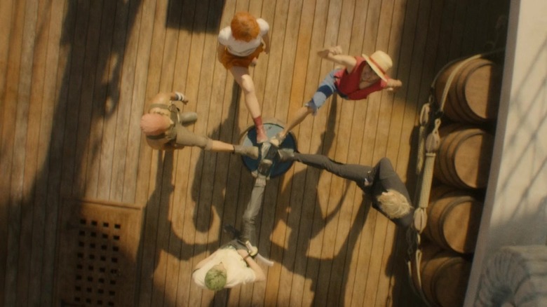 Usopp, Nami, Luffy, Sanji, Zora feet on barrel