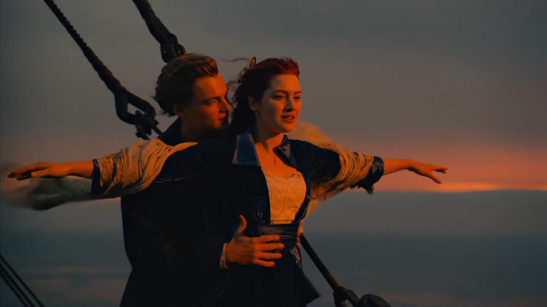 Rose spreading arms as Jack holds her