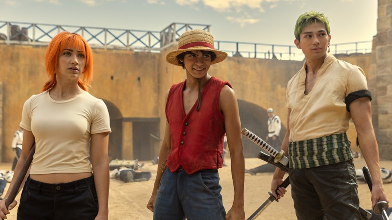 Nami, Luffy, Zoro standing in fort