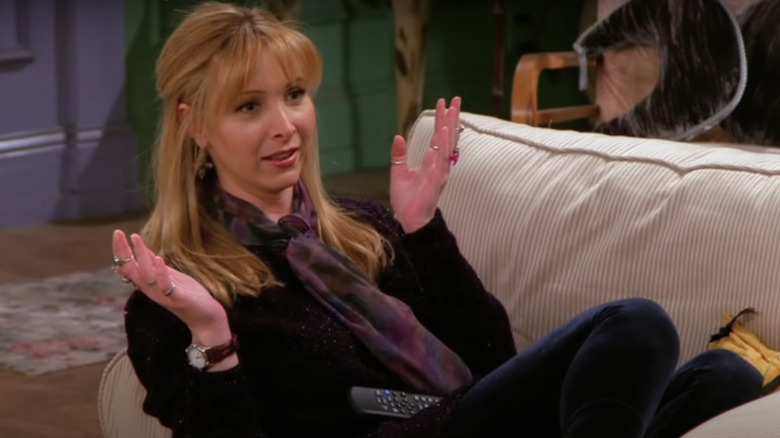 Phoebe gesturing on the couch